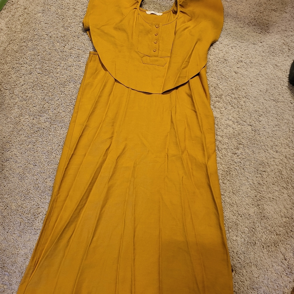 Mustard colored dress with flutter sleeveless detail
